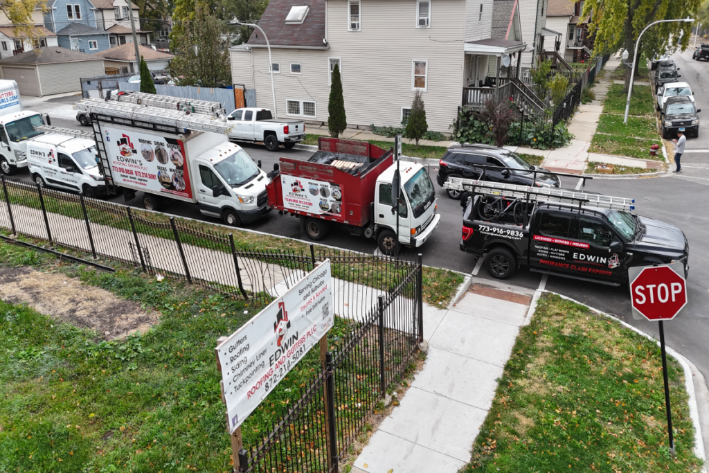 Fleet of professional service trucks from Edwin’s Roofing Experts, ready for roofing, gutter, and siding projects.